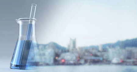 Composition of blue liquid and stirrer in chemistry flask, with blurred copy space to right. medical...