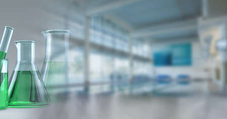 Composition of green liquid in chemistry flask, with blurred background copy space to right. medical...