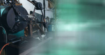 Composition of machinery in industrial workshop with copy space on green background. industry concept digitally generated image.の写真素材