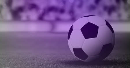 Composition of football on grass pitch with copy space and purple tint. sport and competition concept digitally generated image.の写真素材
