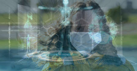 Composition of medical data processing over caucasian woman wearing face mask. global covid 19...