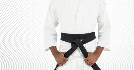 Composition of caucasian male martial artist with black belt over stripes on white background....
