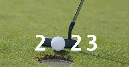 Composition of 2023 number with golf ball and golf club on golf course. sports calendar and competition concept digitally generated image.の写真素材