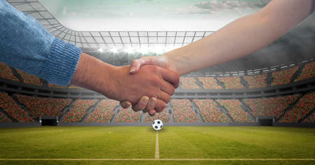 Composition of people shaking hands over sports stadium. sports, deal, agreement and competition concept digitally generated image.の写真素材
