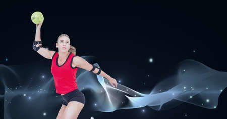 Composition of caucasian female handball player holding ball with copy space on black background. sports and competition concept digitally generated image.の写真素材