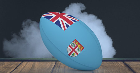 Compostion of rugby ball of fiji flag on black background with white smoke. championships, sports and competition concept digitally generated image.の写真素材