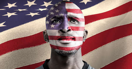 American flag over face of african american male athlete against american flag. american patriotism and sports conceptの写真素材
