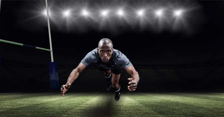 Portrait of african american male athlete diving against stadium in background. sports and fitness...
