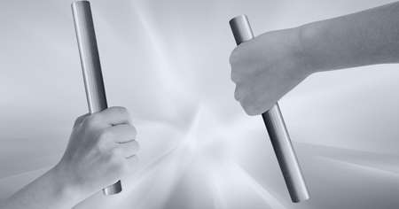 Black and white image of two hands holding batons against stretch effect on grey background. sports and fitness conceptの写真素材