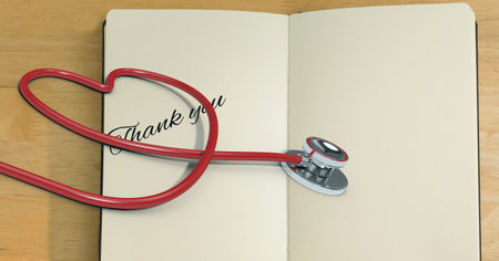 Composition of thank you text with stethoscope and heart. medicine, healthcare services and gratitude concept digitally generated image.の写真素材
