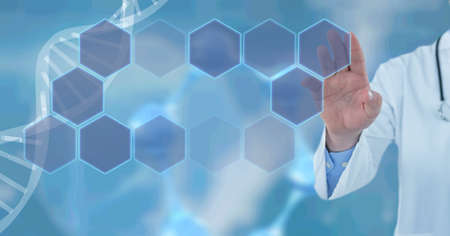 Composition of dna strand and network of hexagons over male doctor's hand. medicine, science and...