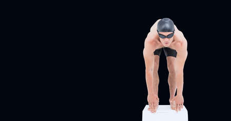 Composition of male swimmer on starting block with copy space isolated on black background. sports and competition concept digitally generated image.の写真素材