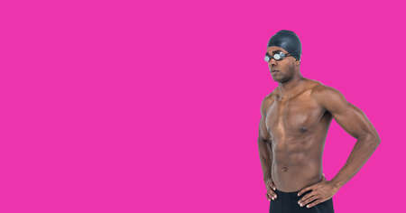 Composition of male swimmer with copy space isolated on pink background. sports and competition concept digitally generated image.の写真素材