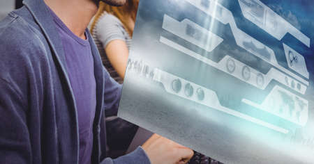 Digital interface with data processing against mid section of people working at office. global...
