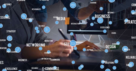 Network of digital icons against mid section of businessman and businesswoman working together....
