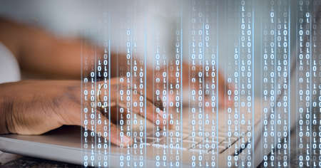 Binary coding data processing against mid section of person using laptop. global business and cyber...