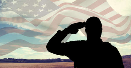 Composition of silhouette of saluting soldier over waving american stars and stripes flag. patriotism, independence and celebration concept digitally generated image.の写真素材