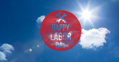 Happy labor day text over red circular banner against clouds in blue sky. american labor day template background design conceptの写真素材