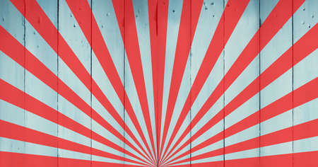 Digitally generated image of orange radial beams and rays against wooden background. background template design conceptの写真素材