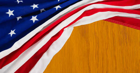 Composition of crumpled american flag on wooden background. patriotism, independence and celebration concept digitally generated image.の写真素材