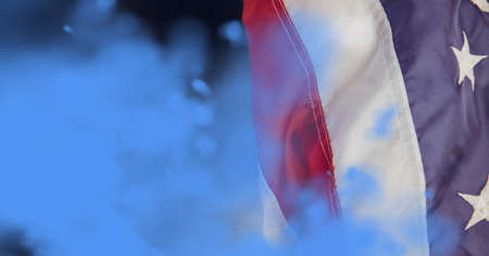 Composition of blue smoke with american flag on black background. patriotism, independence and celebration concept digitally generated image.の写真素材
