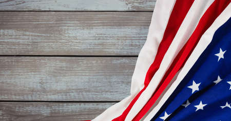 Composition of crumpled american flag on wooden boards. patriotism, independence and celebration...