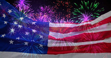 Composition of billowing american flag over fireworks in night sky. patriotism, independence and celebration concept digitally generated image.の写真素材