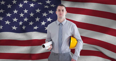 Composition of smiling male architects over billowing american flag. patriotism, independence and labor day celebration concept digitally generated image.の写真素材