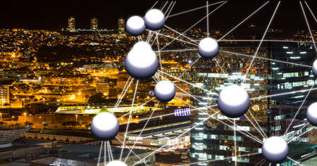 Globe of network of connections against view of cityscape at night. global networking and connection...
