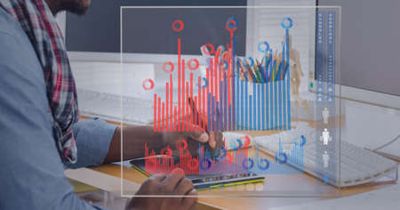 Digital interface with statistical data processing against mid section of man using graphic tablet. global business and technology conceptの写真素材