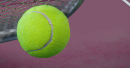 Composition of tennis ball and racket with copy space on tennis court. sports and competition concept digitally generated image.の写真素材