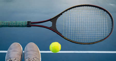 Composition of tennis ball, sports shoes and racket on tennis court. sports and competition concept digitally generated image.の写真素材