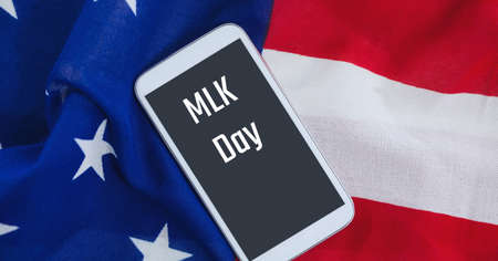 Milk day text on smartphone against american flag in background. milk day template background design conceptの写真素材