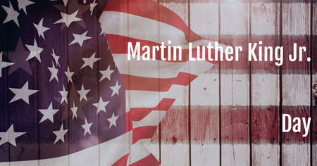 Happy martin luther king day text and waving american flag on wooden background. martin luther king day template background design conceptの写真素材