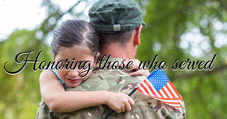 Composition of veterans day text over soldier with his daughter holding american flag. american patriotism, army, home coming and independence concept digitally generated image.の写真素材