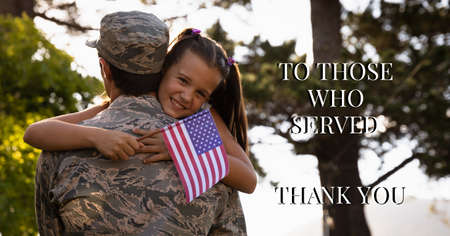 Composition of thank you text over soldier with his daughter holding american flag. american patriotism, army, home coming and independence concept digitally generated image.の写真素材