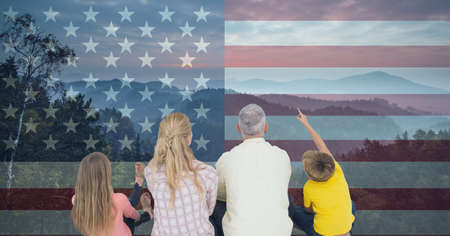 Composition of caucasian couple with son and daughter against american flag. united states of america patriotism and independence concept digitally generated image.の写真素材