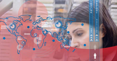 World map against caucasian woman working in server room against red technology background. cyber...