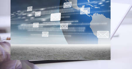 Multiple message icons and binary coding data processing against mid section of person using laptop. global networking and business technology conceptの写真素材