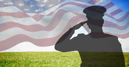 Composition of male soldier saluting over american flag. american patriotism, independence and...