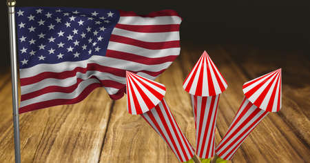 Composition of american flag with fireworks over wooden table. american patriotism, independence and celebration concept digitally generated image.の写真素材
