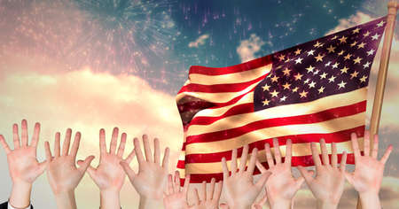 Composition of raising hands over american flag and fireworks. american patriotism, independence and...