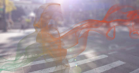Digital composite image of green and orange smoke effect against view of city traffic. global networking and technology conceptの写真素材