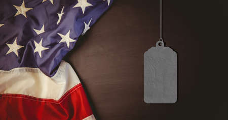 Composition of dog tag army id, with american flag, on wood. patriotism, independence and military concept digitally generated image.の写真素材