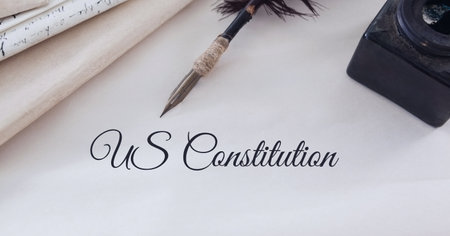 Composition of text us constitution, with quill pen and inkwell on antique documents. patriotism, independence and american constitution celebration concept digitally generated image.の写真素材