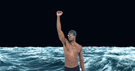 Composition of male swimmer raising hand on black background. sport and competition concept digitally generated image.の写真素材