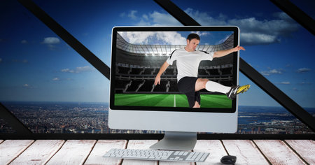 Composition of male football player kicking ball at football stadium in computer. sport and...
