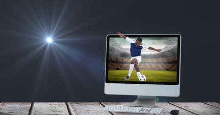 Composition of male football player kicking ball at stadium in computer. sport and competition...