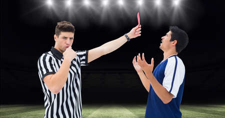 Composition of male referee holding red card and player at football stadium. sport and competition...