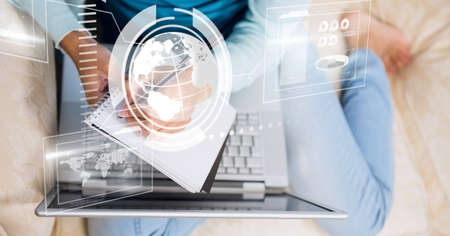 Composition of screen with digital data processing over woman writing using laptop. global digital...